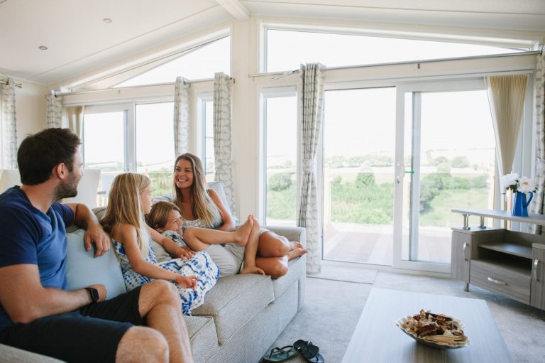 Juliots Well family on sofa in living room